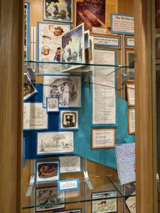 Collage of Jim McMullan illustrations and book covers on display outside the Kerlan Collection office in Andersen Library as part of a small Kerlan Awards 2025 exhibit