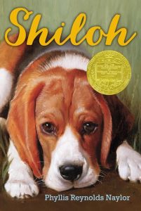 Book cover for "Shiloh" by Phyllis Reynolds Naylor with illustration of a puppy dog